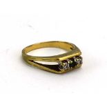 A 9ct yellow gold ring set blue stone and two small diamonds in a split shank setting,