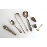 A mixed parcel of silver including a pair of sugar nips, a teaspoon and other items,