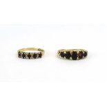 A late 19th/early 20th century yellow gold ring set five graduated garnets,