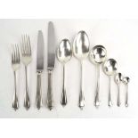 A suite of silver flatware comprising: 12 x table knives, 12 x table forks, 5 x table spoons,
