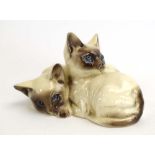 A Royal Doulton figure modelled as a pair of Siamese kittens, Model No. 1296, h.