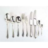 An eight sitting silver service comprising: 8 x table forks, 8 x table knives, 8 x soup spoons,
