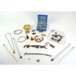 A mixed parcel of silver and costume jewellery including a charm bracelet, a glass pendant,
