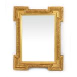 A 19th century mirror, the gilt frame with castellated corners,