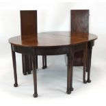 An 18th century mahogany dining table comprising of two D-ends,