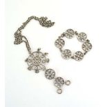 A Scandinavian silver bracelet and matching necklace of openwork wheel design (2)