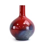 A Royal Doulton flambe bottle vase of spherical form, No. 1618, 24.