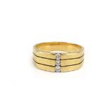 A gentleman's modern 9ct yellow gold graduated band ring set three small brilliant cut diamonds,