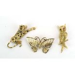 Three 9ct yellow gold brooches in the form of a butterfly, an owl and a cheetah, overall 17.