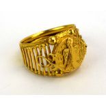 A gents yellow metal ring of South American design, ring size V 1/2, 8.