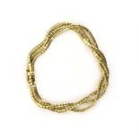 A 9ct yellow gold three strand articulated link bracelet, 16.