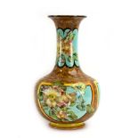 A late 19th century Doulton Lambeth faience vase of squat baluster form painted with wild roses in