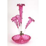 A late 19th/early 20th century cranberry glass four flute table epergne, h. 44.