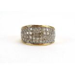 A 9ct yellow gold ring of domed form pave set small diamonds,