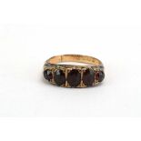 A 9ct yellow gold ring set five graduated garnets, ring size M 1/2, 2.