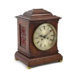 A Regency-type bracket clock, the silvered dial with Roman numerals,