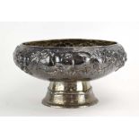 A Scandinavian silver fruit bowl of circular form relief decorated with fruits on a hammered ground,