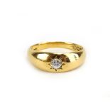An 18ct yellow gold ring set brilliant cut diamond in a recessed star setting, Birmingham 1919,