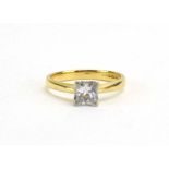 A modern 18ct yellow gold ring set princess cut diamond in a four claw setting, London 1997,