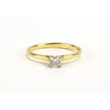 An 18ct yellow gold ring set brilliant cut diamond in a four claw setting, approximately 0.