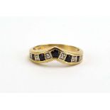 A 9ct yellow gold half eternity ring set five sapphires and six diamonds in a v-shaped setting,