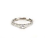 A modern 18ct white gold ring set princess cut diamond in a four claw setting,