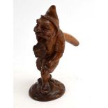 A Black Forest carved nut-cracker modelled as a gnome, h.