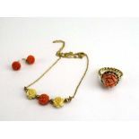 A 9ct yellow gold fine chainlink necklace set three coral flowerheads,