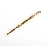 A 9ct yellow gold propelling toothpick, l. 15.7 gms, 3.