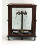 A 1920's German Sartorius-werke analytical balance/pharmaceutical scales contained in an oak and