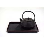 A Nanbu Tekki Japanese iron teapot, mark to base 'Tekki Nolppin',