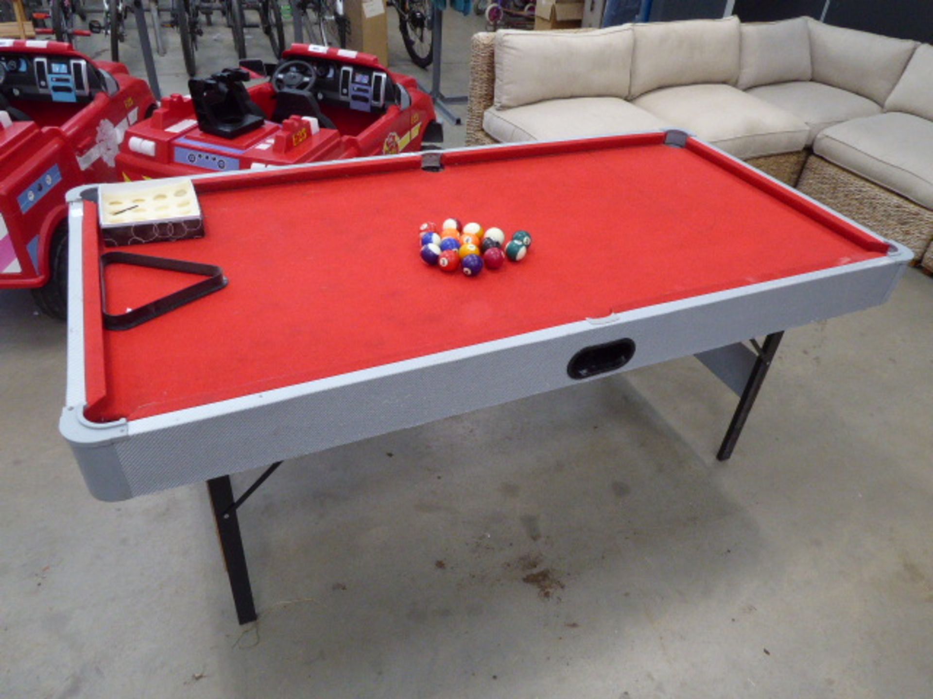 Folding pool table with balls