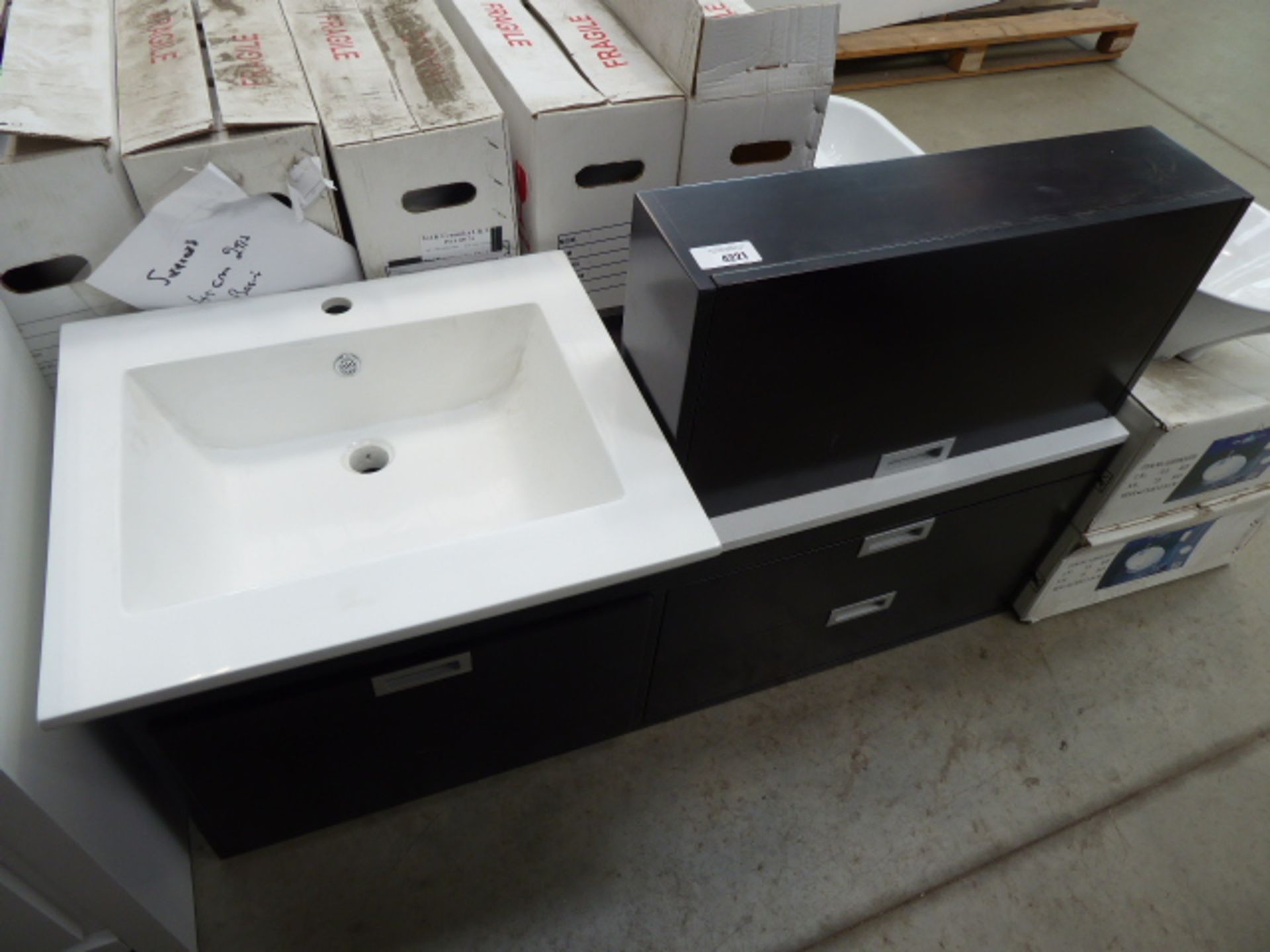 Black vanity unit and white rectangular sink