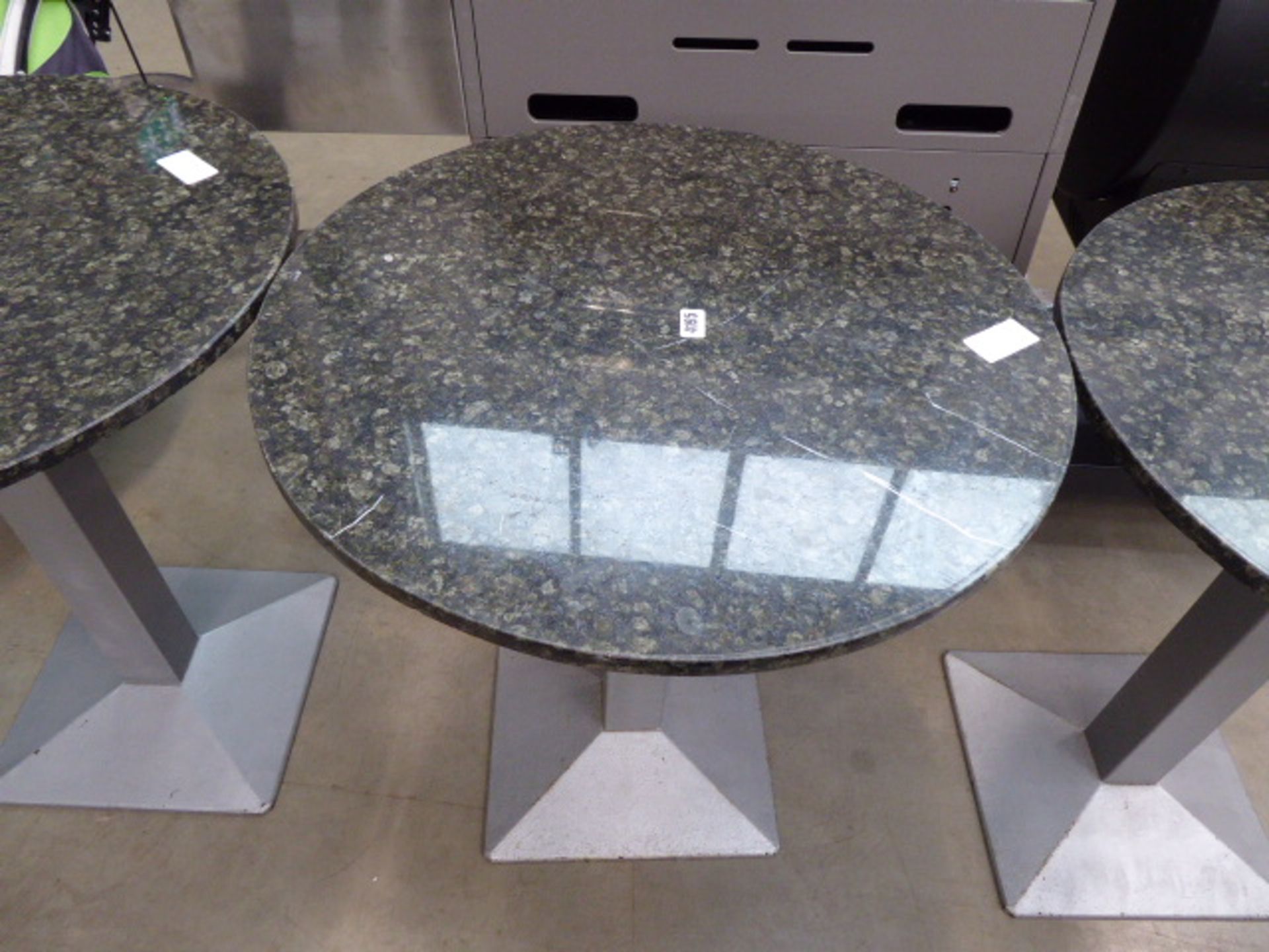 Stone topped bistro table on grey supports