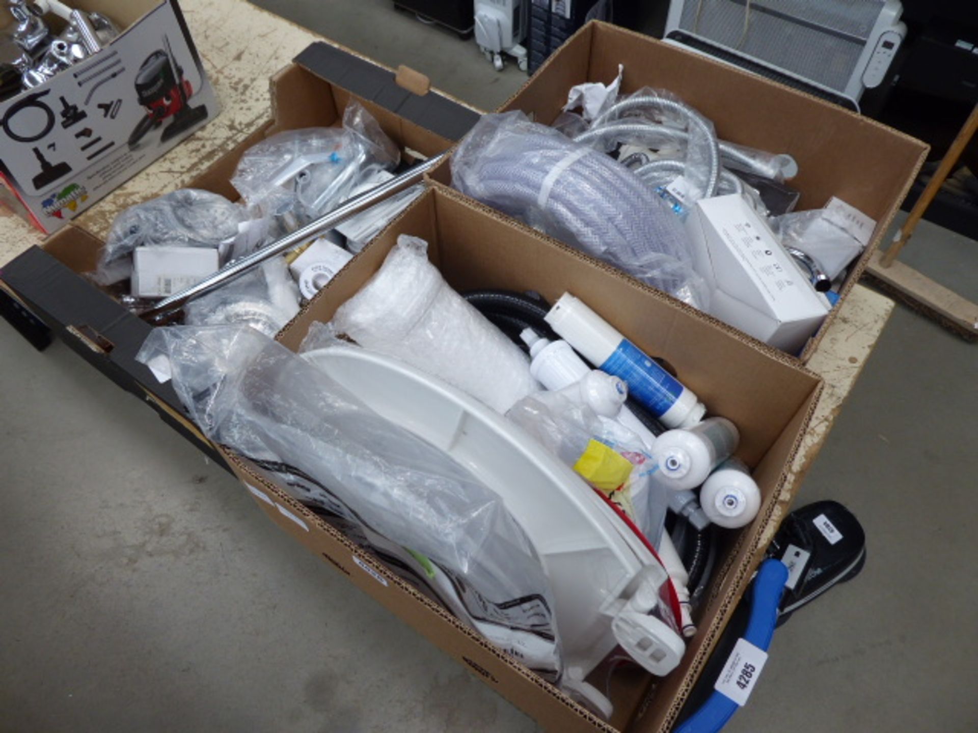 3 boxes of plumbing items inc. filters. pipe, shower pipes, towel rails, Worcester dials and