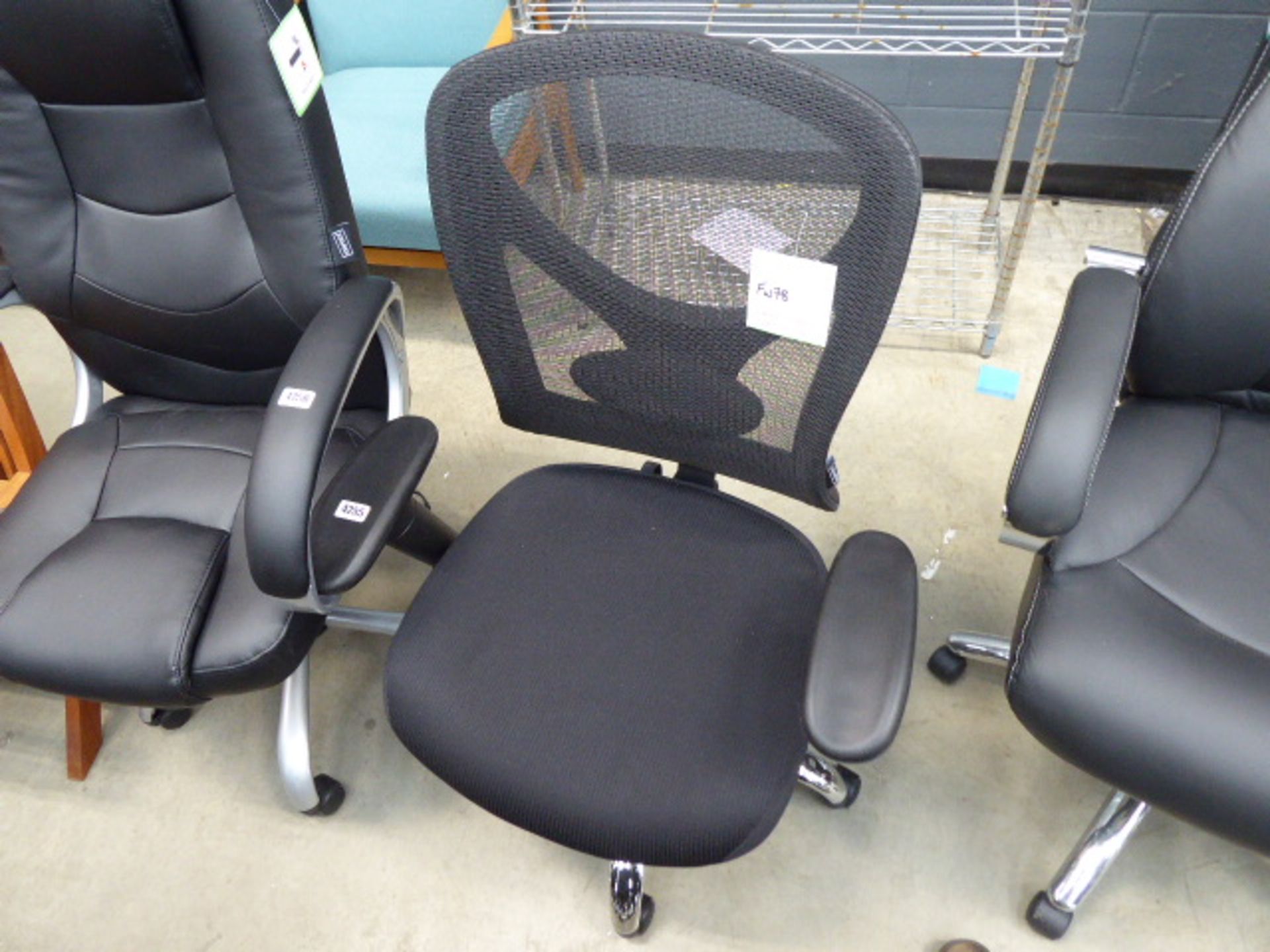 Mesh backed office armchair on black on chrome supports