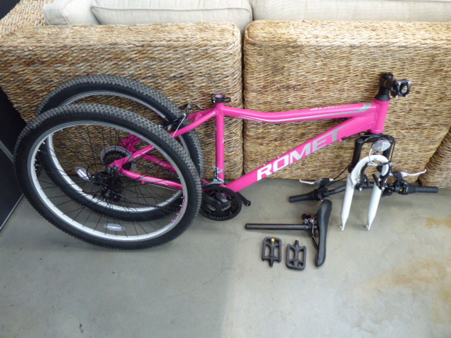 Boxed Romet mountain bike in pink