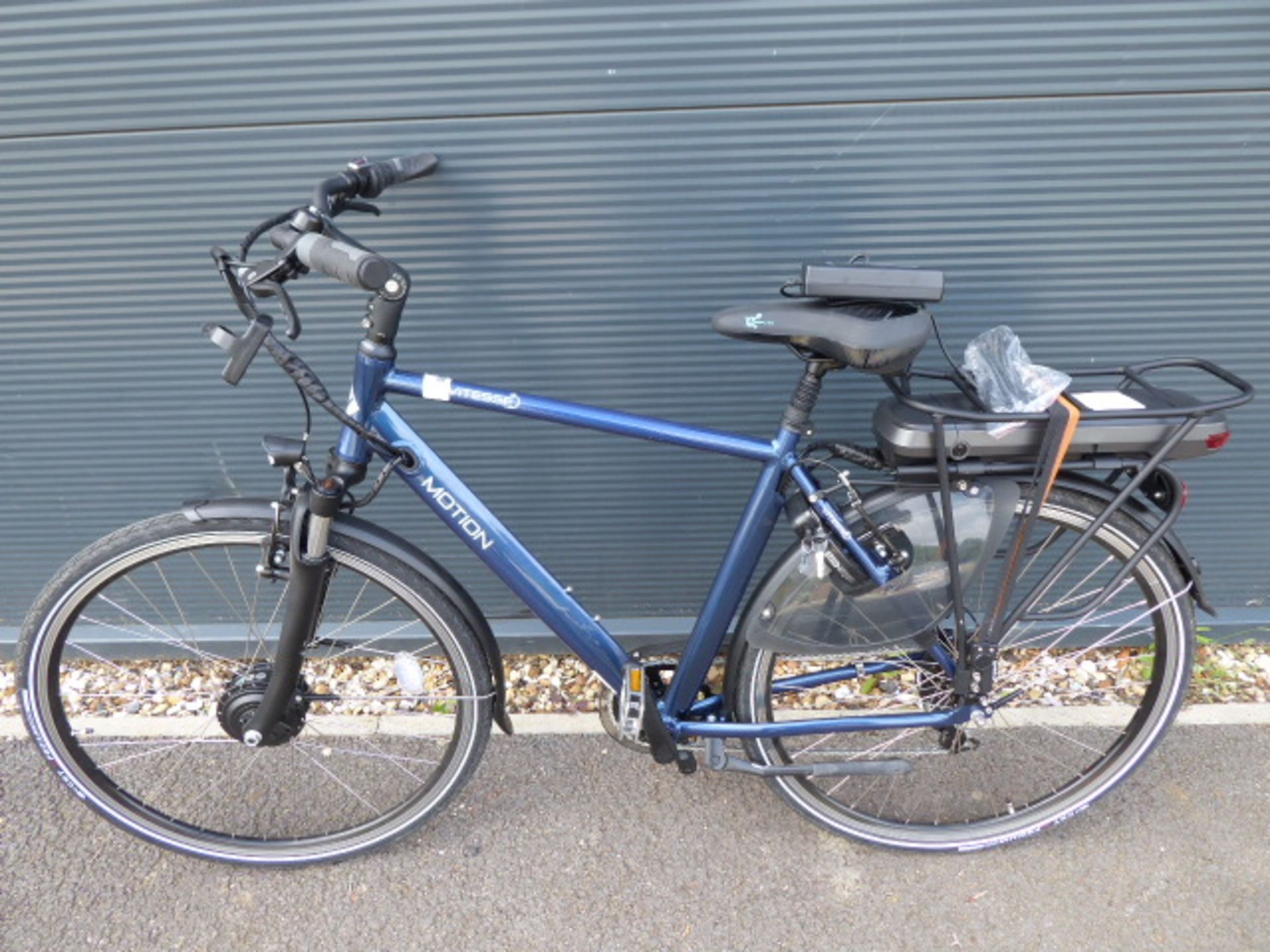 Vitesse Motion electric bike in blue with battery charger