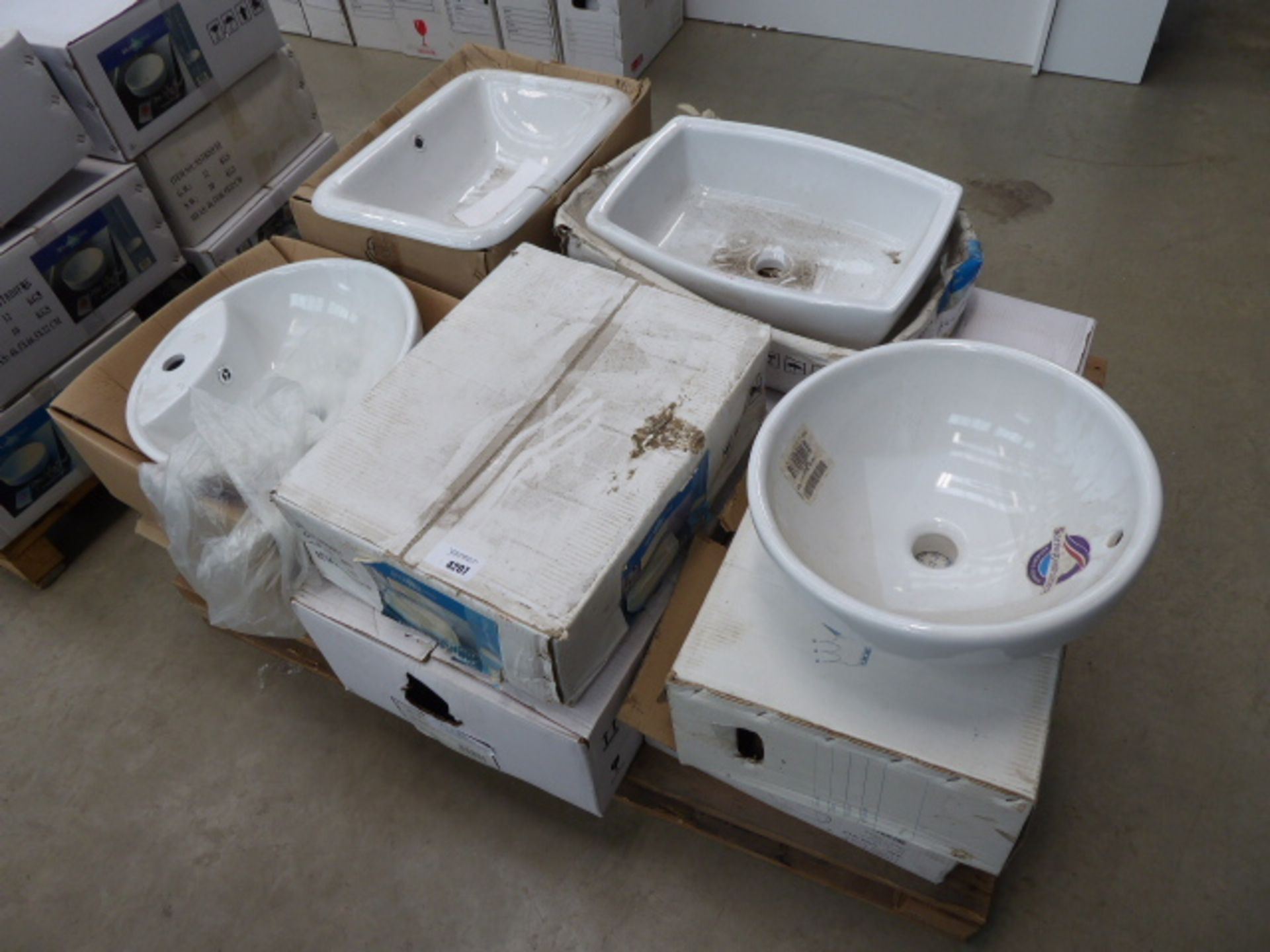 Pallet of assorted white sinks