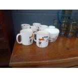 Quantity of Guiness advertising works in the form of mugs and a sugar bowl