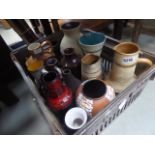 Box containing studio pottery vases and jugs