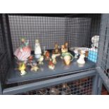 Cage containing Hummel figures, Beswick birds a Royal Doulton lady, a Royal Worcester lady and a