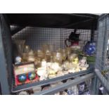Cage containing glassware, ornaments, ornamental cottages and stress balls