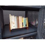 Cage containing a quantity of angling related books