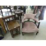 Nest of tables in oak with Victorian low armchair upholstered in pink draylon