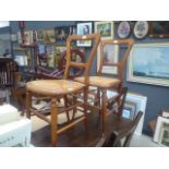 Pair of Edwardian provincial dining chairs with wicker seats