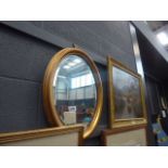 Oval bevelled mirror in gilt frame