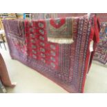 (11) Red Bokhara carpet (3 x 3 1/2 meters)