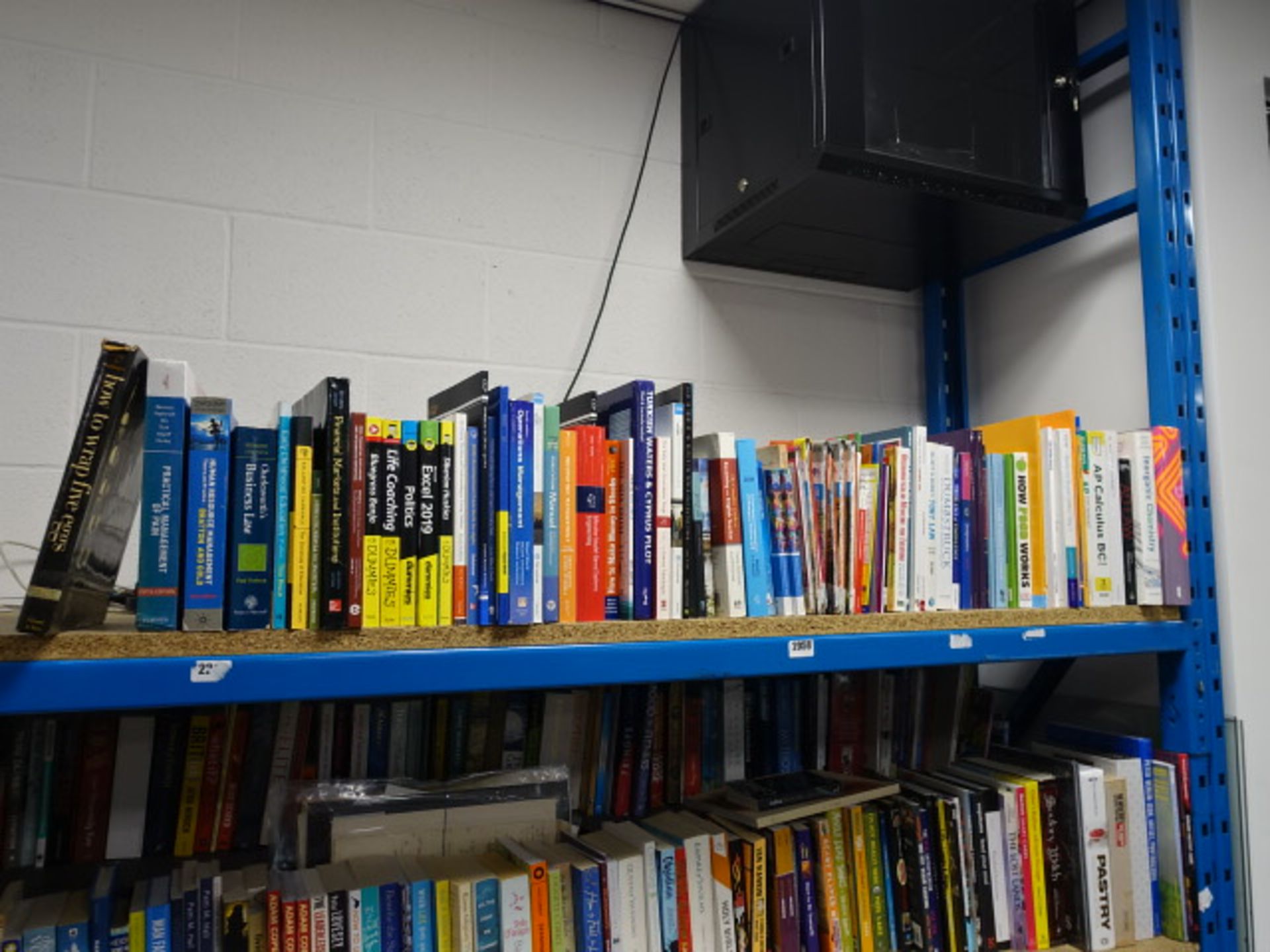 Shelf comprising of a large selection of reference materials and study books by various publishers