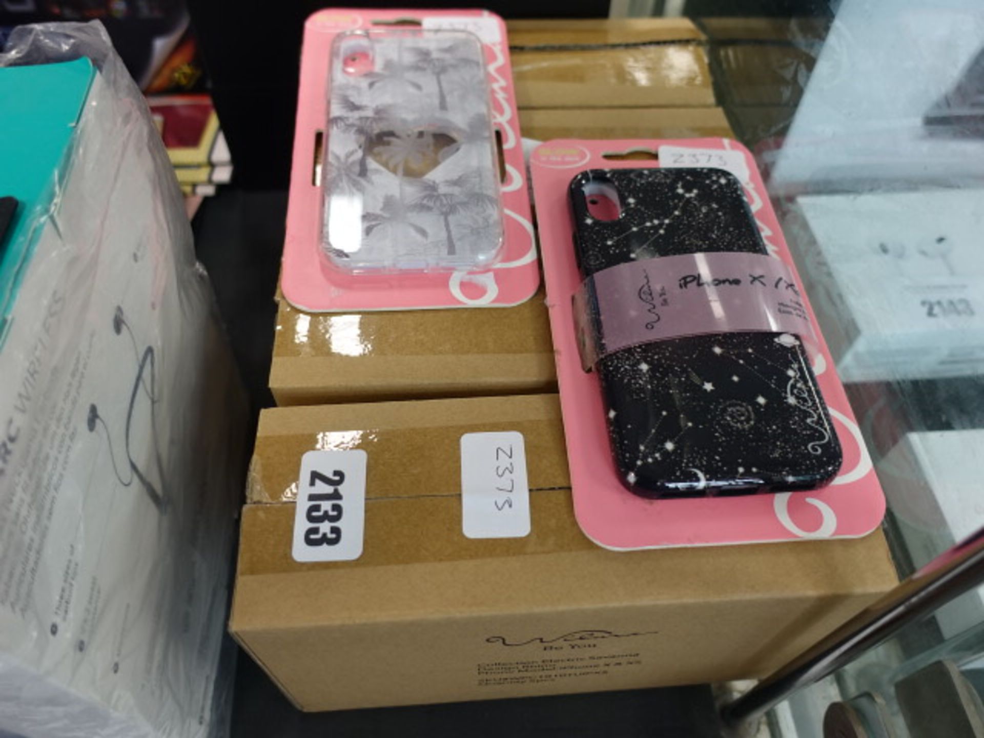 4 boxes and 2 other glow in the dark mobile phone cases